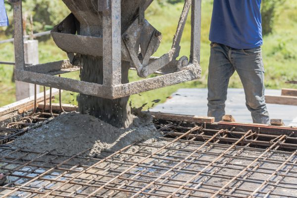 worker-open-cement-bucket-tank-machine-on-fence-fr-2025-01-07-23-15-15-utc (1)